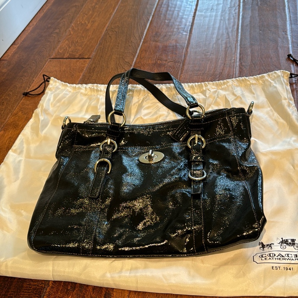 Black Coach purse with plastic-coated leather